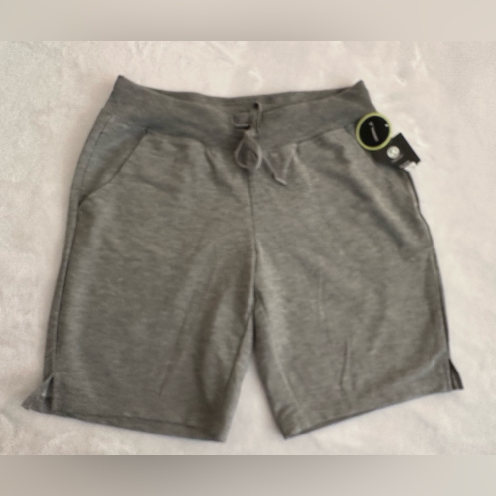 NWT athletic women’s gray long pull on shorts.